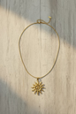 Colar sol dourado